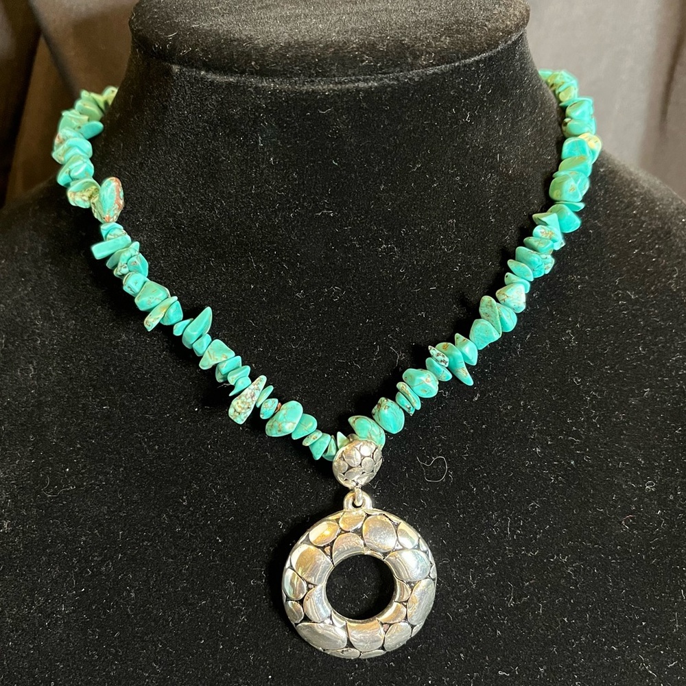 Necklace with turquoise colored beads and silver metal pendant, adjustable